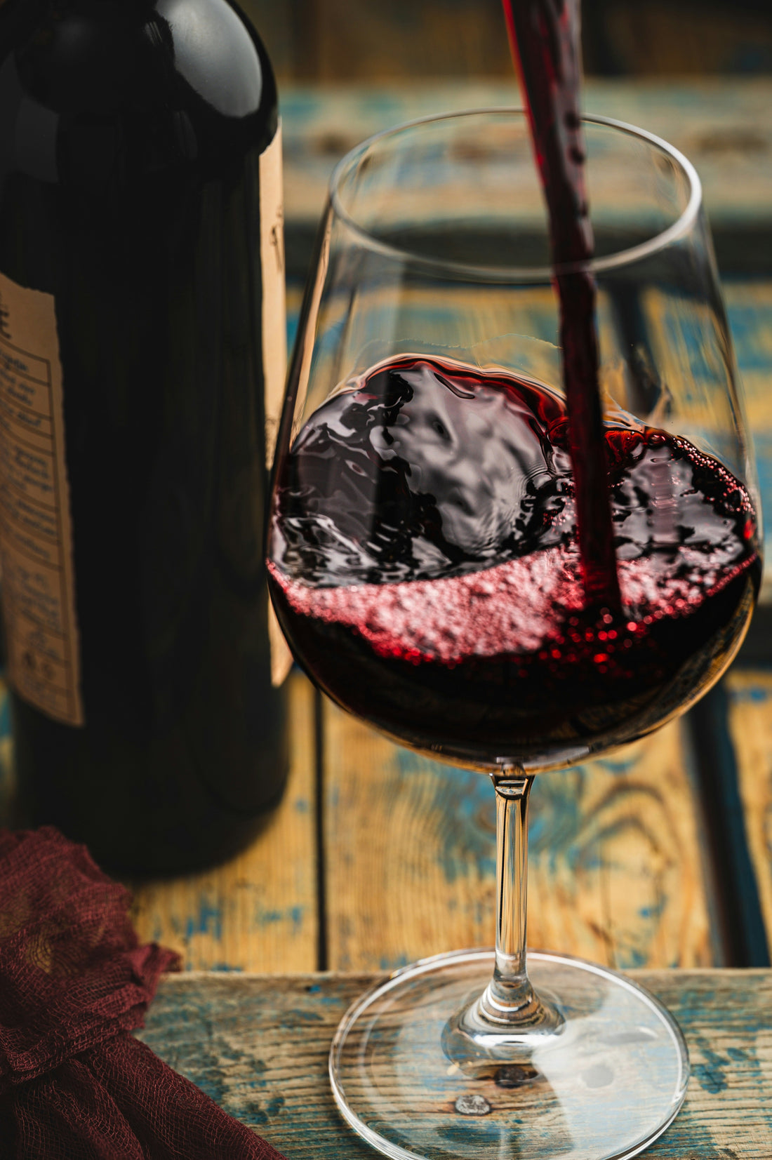 Red wine being poured into a glass