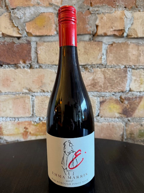 Wine bottle with a red cap and white label with an outline of a lady.